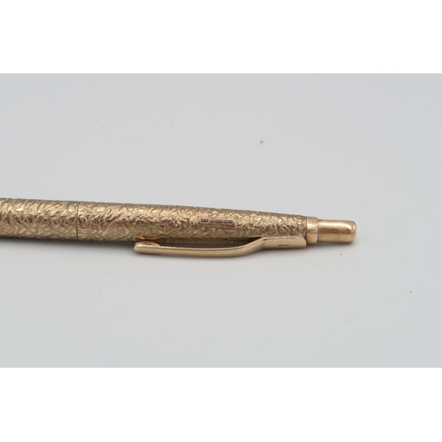 41 - A 9ct yellow gold ball point pen, textural finish - weight without cartridge - weight approx 18.64 g... 