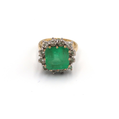 43 - A 18ct yellow gold emerald and diamond cluster ring, the square emerald estimated 5.59cts surrounded... 