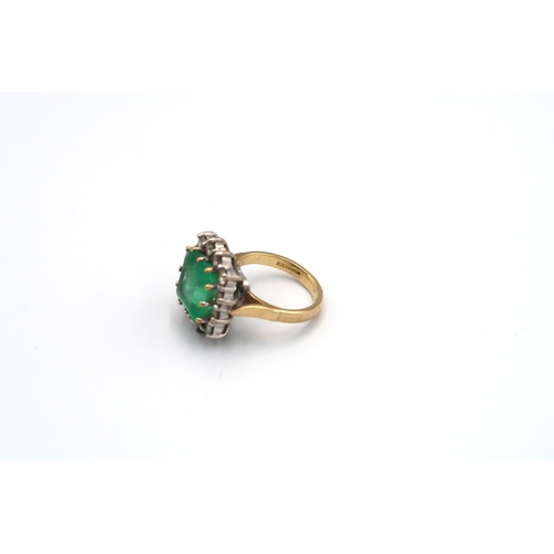 43 - A 18ct yellow gold emerald and diamond cluster ring, the square emerald estimated 5.59cts surrounded... 