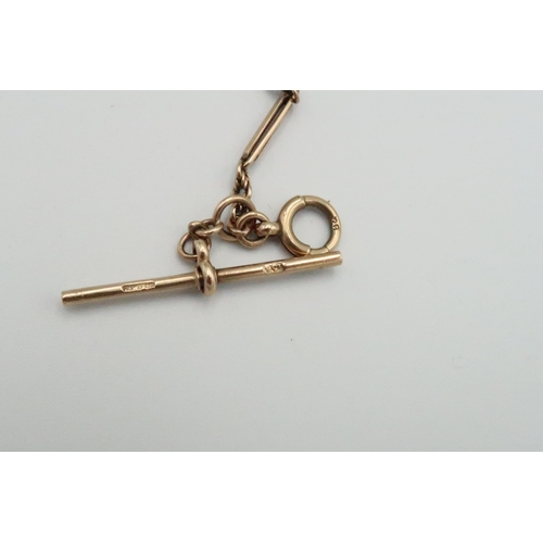 47 - A 9ct gold watch chain with T bar - length approx 37cm - weight approx 11.66 grams