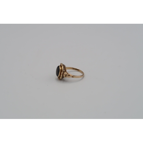 6 - A tigers eye oval panel ring. Size O 1/2. Stamped 14K. Weight approx 3.28 grams.