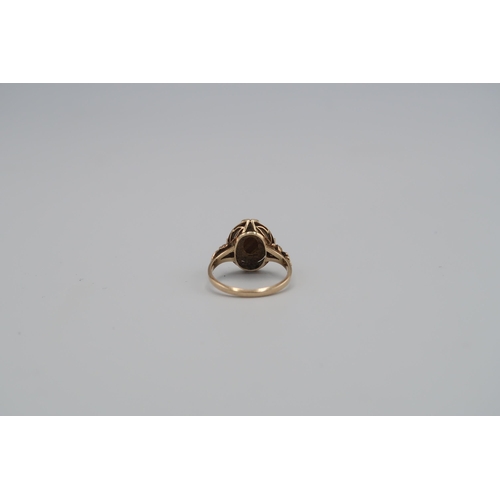 6 - A tigers eye oval panel ring. Size O 1/2. Stamped 14K. Weight approx 3.28 grams.