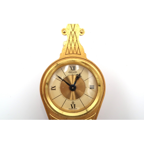 611 - A Jaeger Le Coultre Bellows clock finished in gilt metal with Roman Numerals at 12, 3, 6 & 9 - runni... 