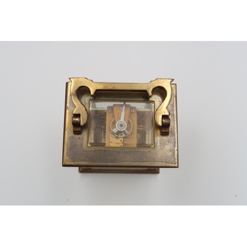 614 - A brass cased carriage clock, ACG to back, with key, Roman numerals to dial, running in saleroom