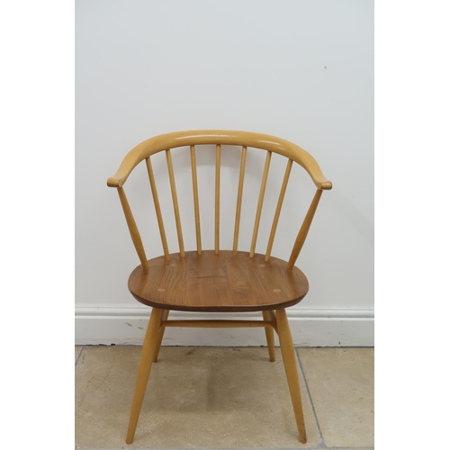 626 - An Ercol blonde elm cow horn lounge chair, label to underside of seat, height to seat 43cm, total he... 