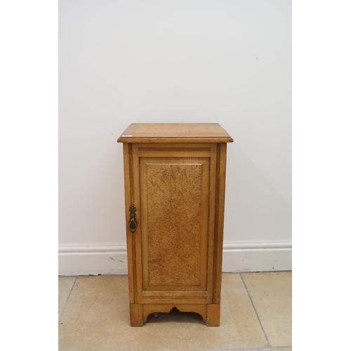 627 - A light oak pot cupboard with panel door.