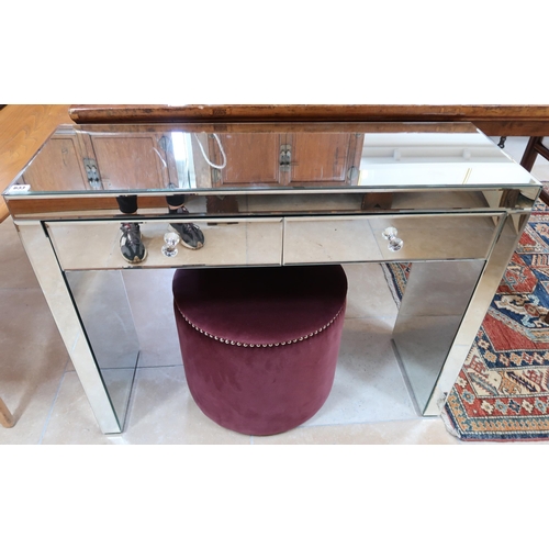 633 - A mirrored dressing table, two drawers over twin pedestals, 101cm wide x 35cm deep x 77cm high, and ... 