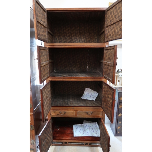 636 - A Chinese hardwood modular cabinet of four sections, each with two doors, the bottom section with tw... 