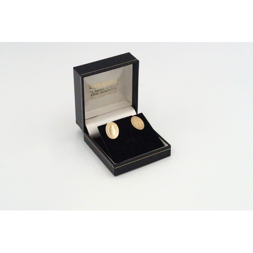 64 - A pair of oval 9ct gold cufflinks - approx weight 2.2 grams