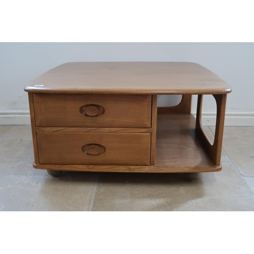 647 - An Ercol blonde elm mid 20th Century Pandora coffee table with a width of 80cm x 81cm x 40cm high.