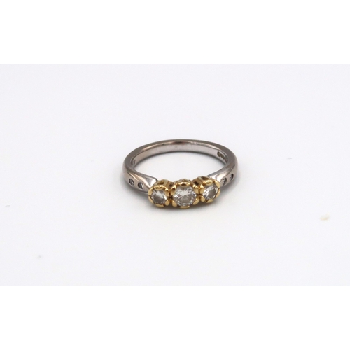 65 - An 18ct white and yellow gold diamond seven stone ring size M 1/2 - approx weight 4.52 grams