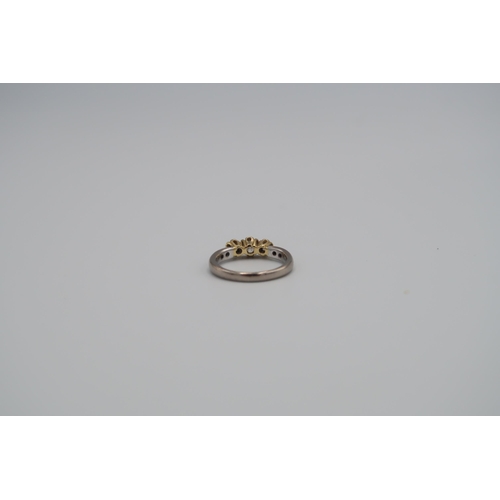 65 - An 18ct white and yellow gold diamond seven stone ring size M 1/2 - approx weight 4.52 grams