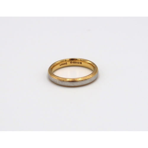 69 - A 22ct white and yellow gold wedding band, size L/M, approx 5.27 grams