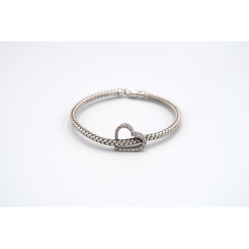 79 - A 14ct white gold heart shaped diamond bracelet, approx 9.6 grams