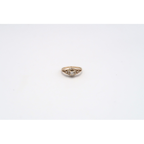 8 - A diamond cluster ring. Estimated total diamond weight 0.50ct. One diamond missing. Stamped 14K. Rin... 