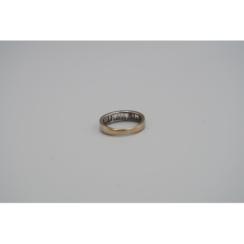 82 - An 18ct yellow gold eternity ring with baguette cut diamonds to shoulder, size K, approx 3.4 grams