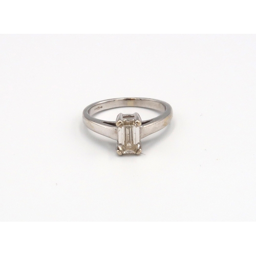 83 - A 18ct white gold and emerald cut diamond ring, estimated 0.92ct K/L SI1/2 size K, approx 3.84 grams