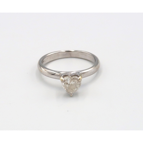 84 - An 18ct white gold ring with heart shaped diamond estimated 0.70ct, I/J 1/2, size M 1/2, approx 3.17... 