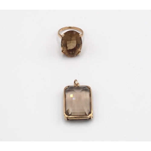 86 - A smokey quartz pendant set in 9ct yellow gold with a 9ct yellow gold ring with oval cut smokey quar... 