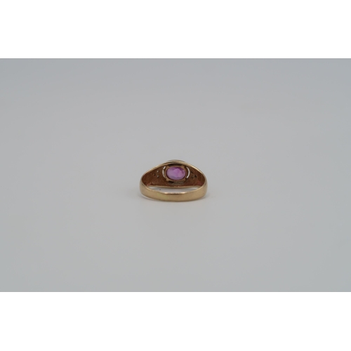 9 - A pink sapphire and diamond dress ring. Size K 1/2. Stamped 14K. Weight approx 2.58 grams.