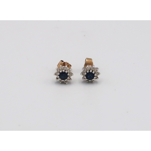 91 - A pair of 18ct white gold diamond and sapphire stud earrings, approx 2 grams