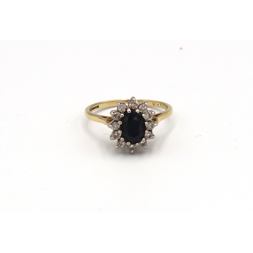 94 - An 18ct yellow gold sapphire and diamond cluster ring, size P/Q, approx 3.75 grams