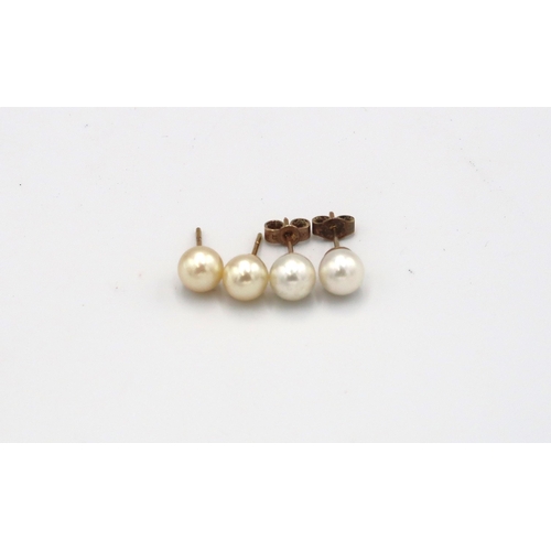 95 - Two pairs of 9ct yellow gold and pearl stud earrings