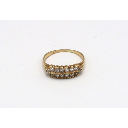 96 - An 18ct yellow gold two row diamond ring, approx 2.5 grams, size N