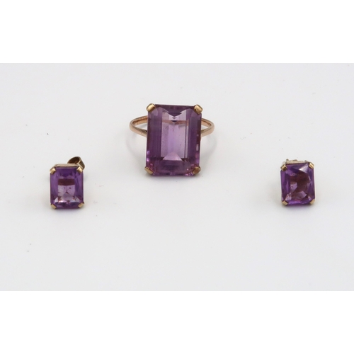 98 - A 9ct yellow gold and amethyst ring size P (no marking of ct) and a pair of amethyst and 9ct gold ea... 