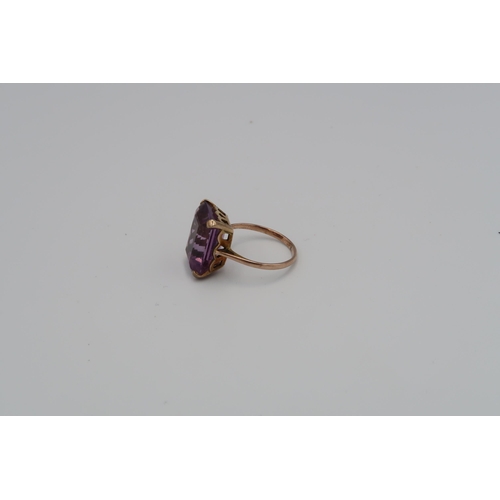 98 - A 9ct yellow gold and amethyst ring size P (no marking of ct) and a pair of amethyst and 9ct gold ea... 