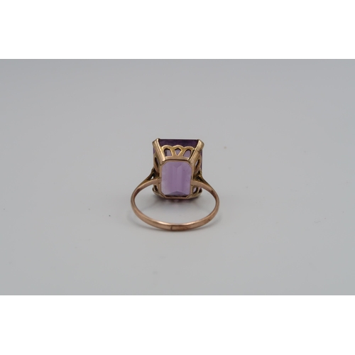 98 - A 9ct yellow gold and amethyst ring size P (no marking of ct) and a pair of amethyst and 9ct gold ea... 