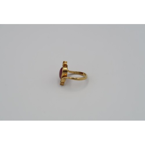 159 - A 9ct Yellow Gold Dress ring with Oval cut red gemstone to shoulder Size R - approx weight 6.3 grams