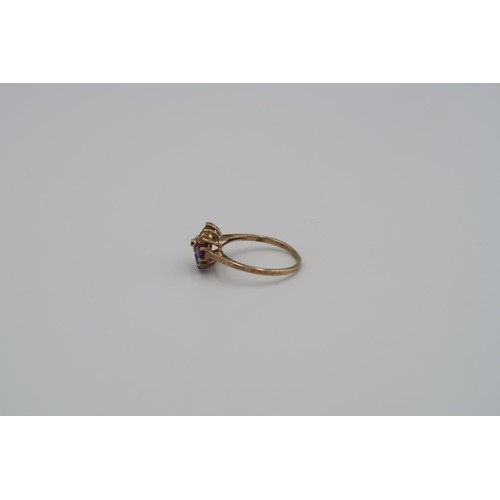 165 - A 9ct Yellow Gold Flower head dress ring, with alternate coloured gemstones to shoulder. Size R - ap... 