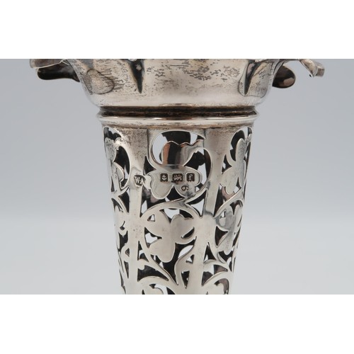 378 - A pair of hallmarked silver trumpet vases with pierced foliate decoration, weighted