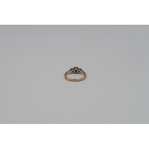 153 - A 9ct gold and platinum, diamond and sapphire dress ring. Size O/P - approx weight 2.6 grams.