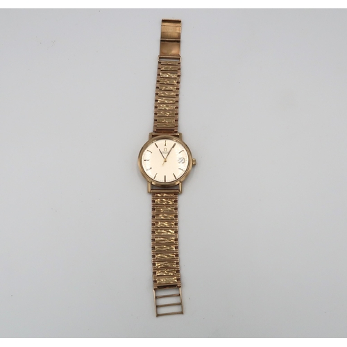 253 - A gents 9ct gold cased Omega automatic on 9ct gold strap with baton markers to champagne coloured di... 