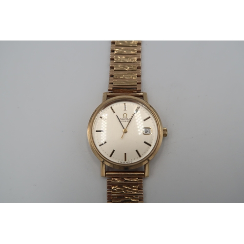 253 - A gents 9ct gold cased Omega automatic on 9ct gold strap with baton markers to champagne coloured di... 