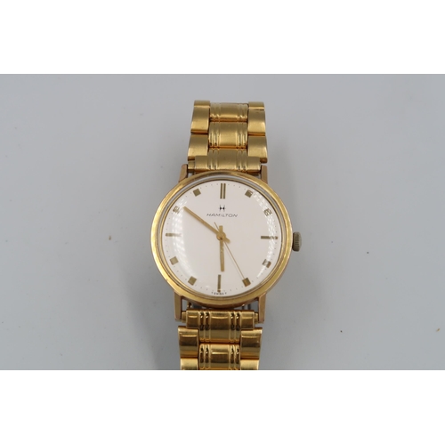 268 - A gents gold plated Hamilton wristwatch with baton markers to white dial - running in the saleroom