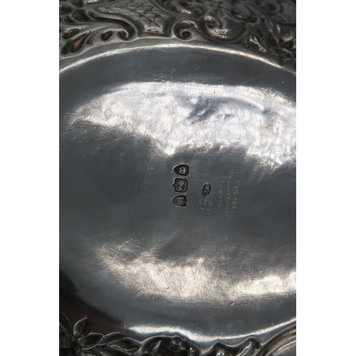 396 - A pair of H.M. Silver sweetmeat dishes with embossed decoration. 11.2 Troy oz.