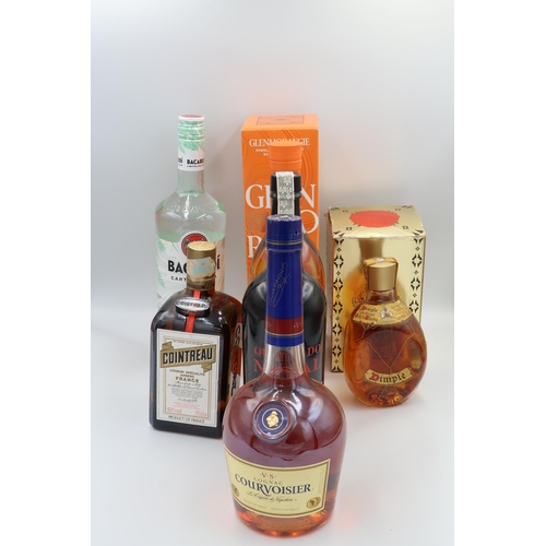 467 - A bottle of 10 year Glenmorangie 70cl, a bottle of VS Cognac Courvoisier 70cl, a bottle of Bacardi C... 