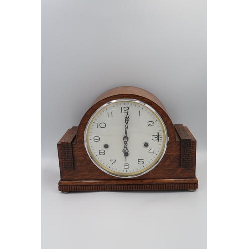 620 - An oak case mantle clock with Westminster/Whitting chime - 8 day movement