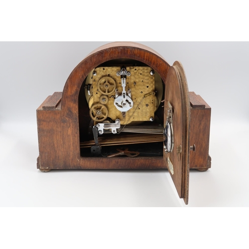 620 - An oak case mantle clock with Westminster/Whitting chime - 8 day movement