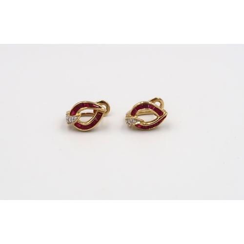 66 - A pair of tested 18ct gold ruby and diamond stud earrings, approx 4.27 grams