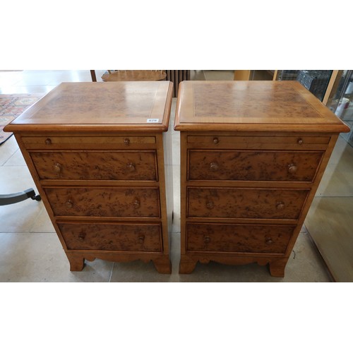 679 - A pair of Yew bedside tables of three drawers each, 40cm wide x 44cm deep x66cm high. Built by a loc... 