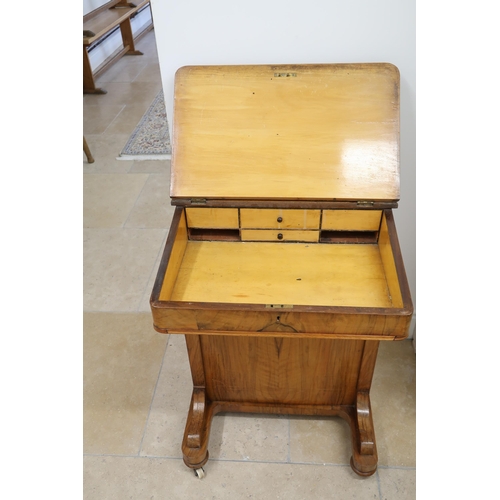 667 - A Victorian Walnut Davenport, with tooled leather top opening to reveal fitted interior, with four d... 