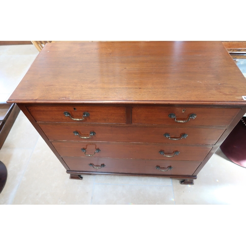 671 - A Georgian mahogany chest of two short over three long drawers raised on bracket supports.