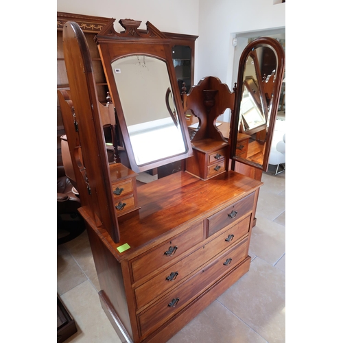 681 - A Mahogany late 19th Century bat wing dressing chest with three mirrors over trinket drawers above t... 