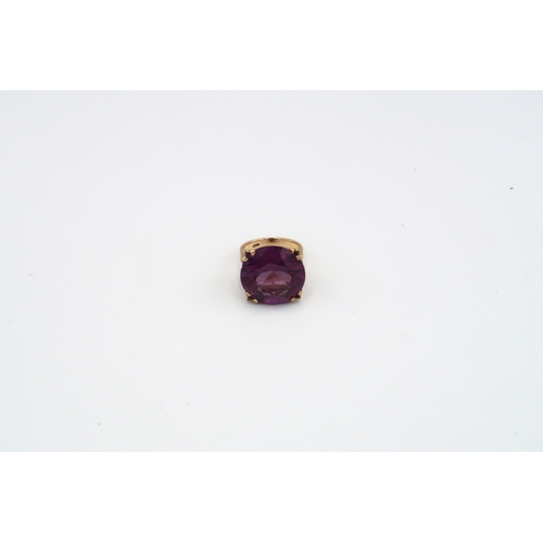 71 - A single purple stone ring. Believed to be synthetic sapphire. Stamped 585. Size P 1/2. Weight appro... 