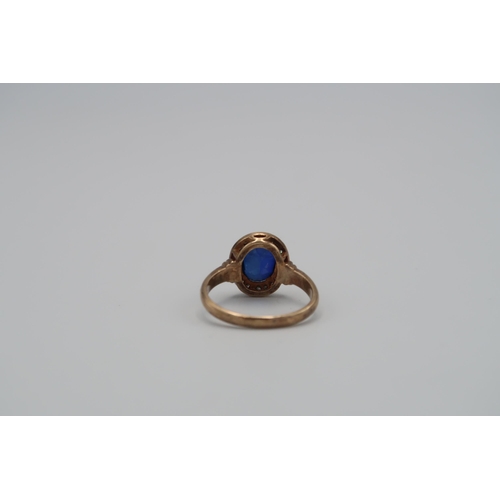 77 - A diamond and synthetic sapphire cluster ring. Stamped 9ct. Size R. Weight approx 4.63 grams. Togeth... 