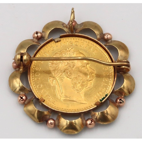 14 - A 1915 Ducat coin brooch with pendant fitting Within an openwork surround, stamped 585. Weight 6.19 ... 